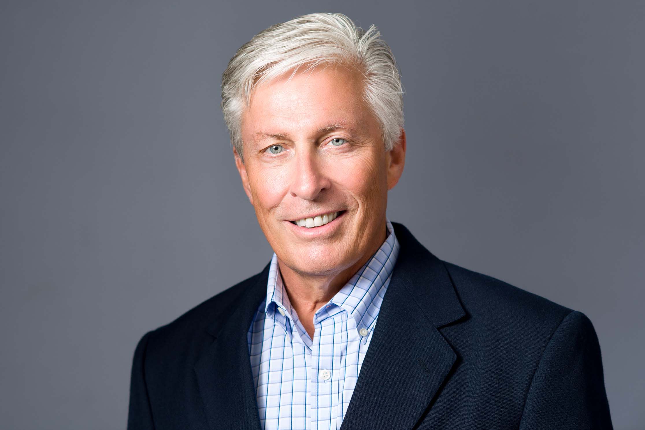 Professional headshot portrait showing confident expression and clean background for personal branding